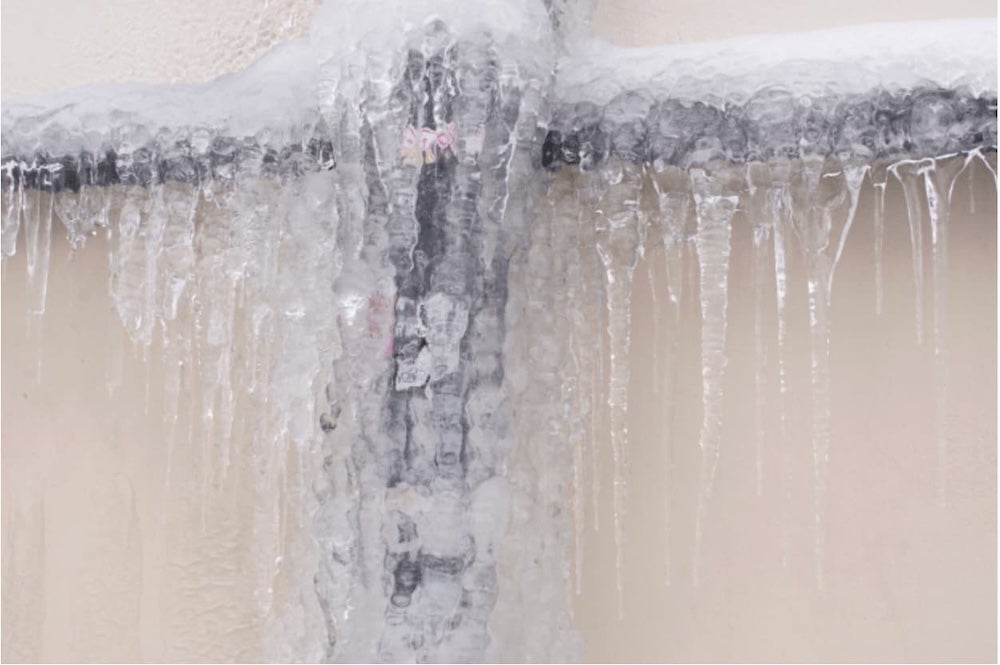 An image of iceicles on a house window