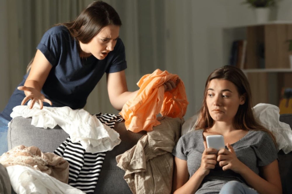 Two roommates seemingly arguing over washing