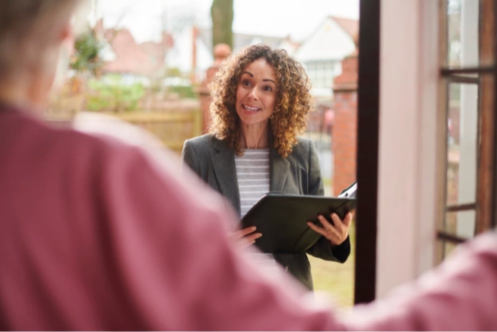 A landlord or agent speaking to a homeowner