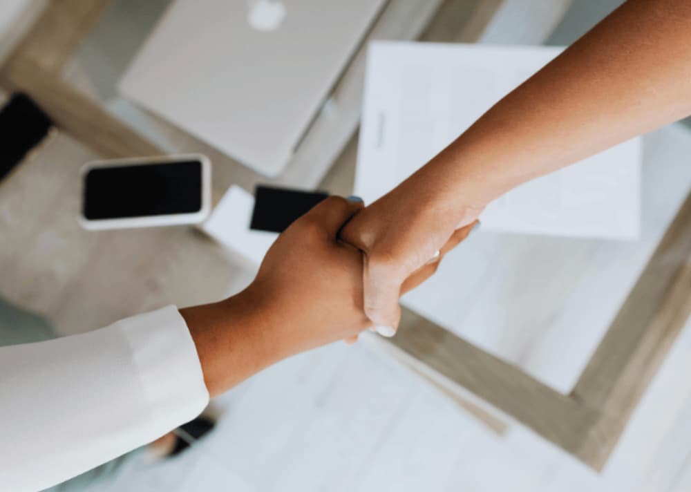 An image of two people shaking hands
