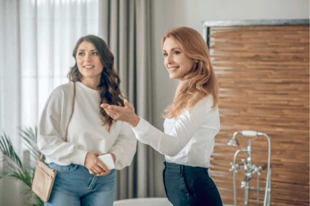 Two women looking round a house