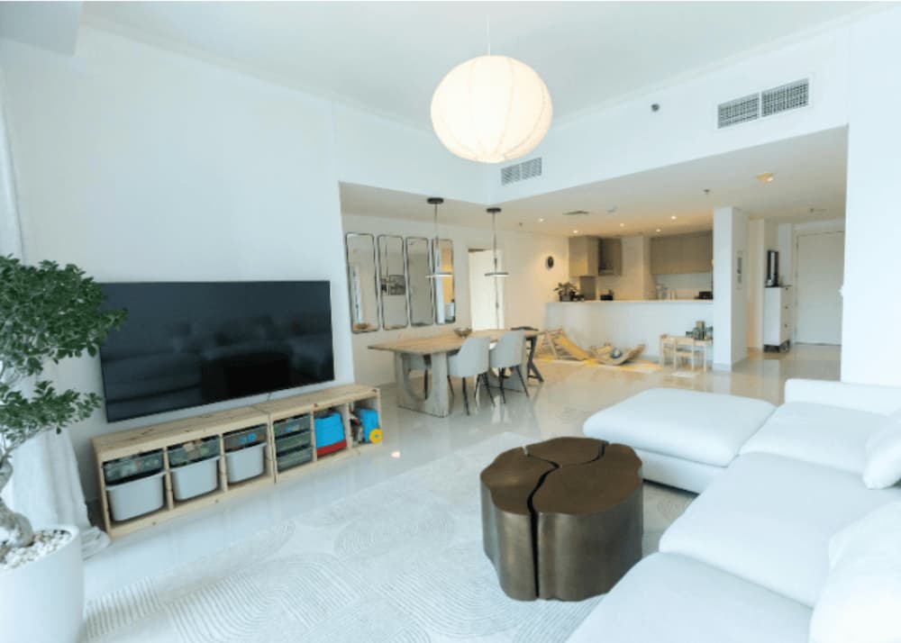 An image a large open plan livingroom and kitchen