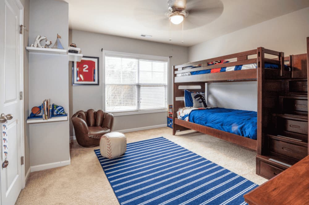 An image of a tidy childs room with a bunk bed