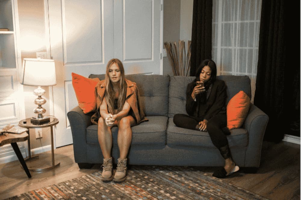 An image of two people sat on a couch