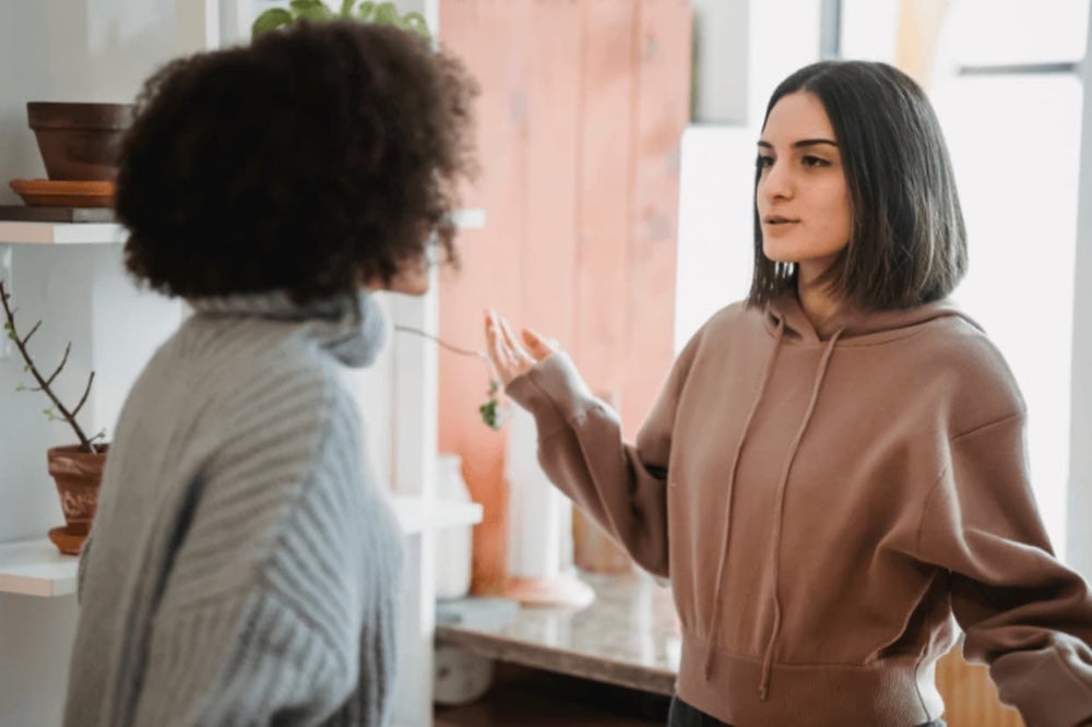 Four roommates conversing