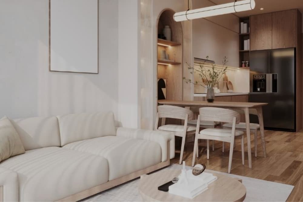 An image of a tidy open living room/kitchen in an appartment