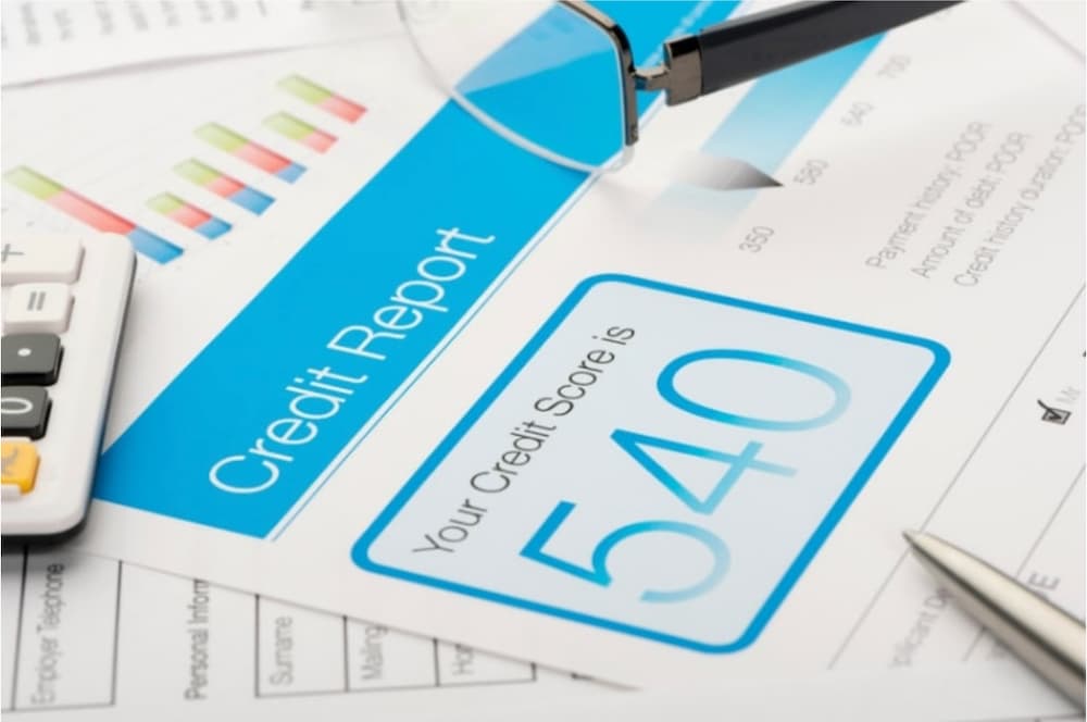 An image of a credit score on paper reading 540