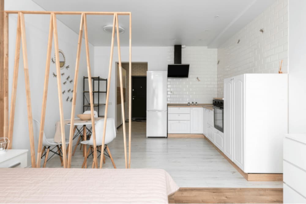 A view of a tidy appartment open plan kitchen and living room