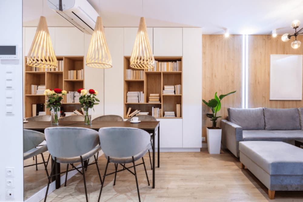 An of a tidy open plan living room and dining table