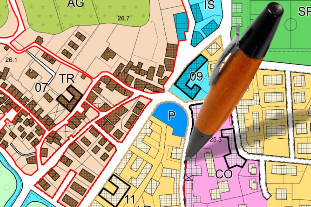 An image of a map with a pen drawing lines on it